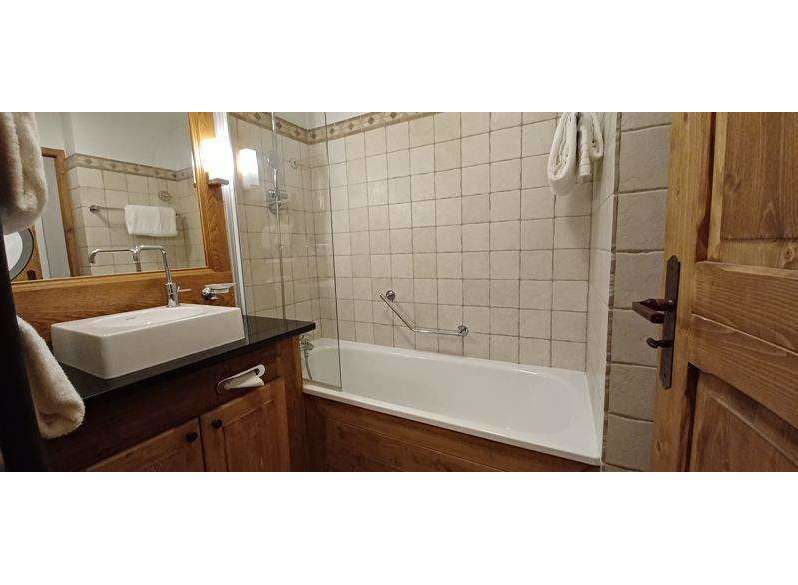 Discover a cozy bathroom with a bathtub and shower combination.