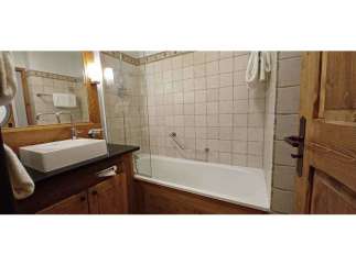 Discover a cozy bathroom with a bathtub and shower combination.