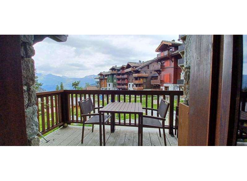 Enjoy breathtaking mountain views from this charming balcony.