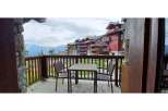 Enjoy breathtaking mountain views from this charming balcony.