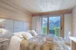 Experience the ultimate in alpine luxury in this stunning bedroom.