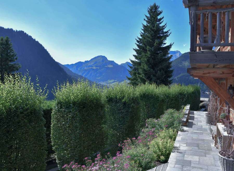 Experience breathtaking mountain views from this charming property.