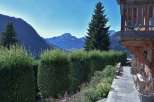 Experience breathtaking mountain views from this charming property.