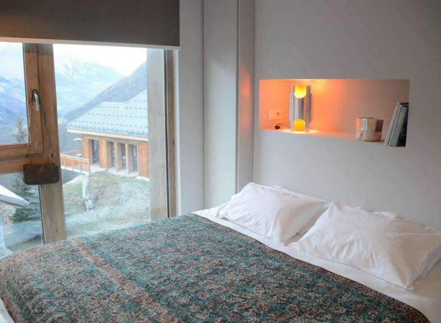 Experience the ultimate mountain retreat in this cozy bedroom.