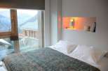Experience the ultimate mountain retreat in this cozy bedroom.