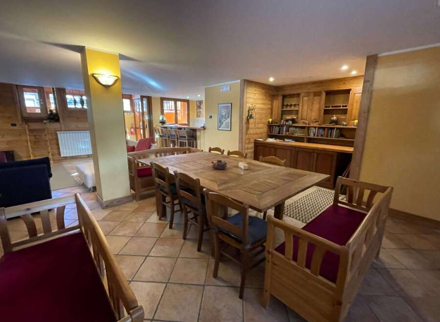 This cozy dining area features a large wooden table perfect for gatherings.