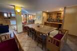 This cozy dining area features a large wooden table perfect for gatherings.