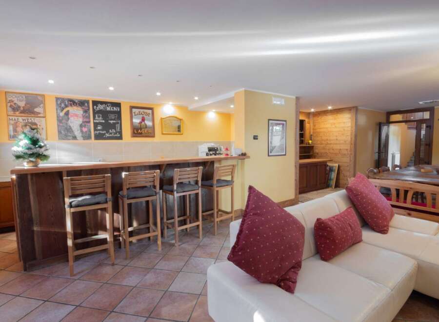 This property boasts a stylish bar area, perfect for entertaining guests.