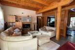 Experience rustic charm in this stunning home featuring exposed wooden beams and cozy living spaces.