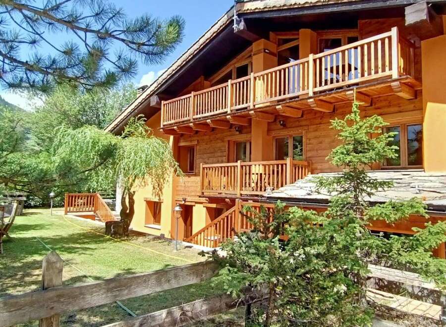 Discover a charming wooden chalet nestled in a serene natural setting.