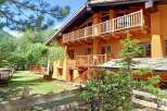 Discover a charming wooden chalet nestled in a serene natural setting.