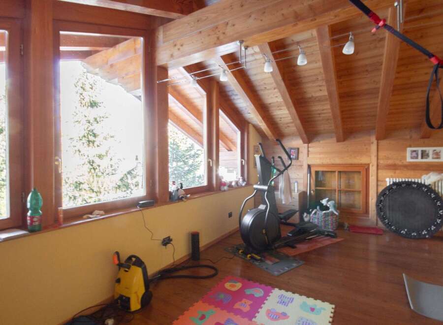 This stunning property boasts a bright and airy interior with beautiful wooden accents throughout.