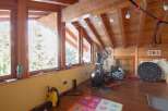 This stunning property boasts a bright and airy interior with beautiful wooden accents throughout.