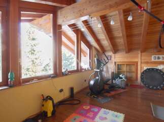 This stunning property boasts a bright and airy interior with beautiful wooden accents throughout.