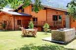 Escape to this charming chalet nestled in the mountains, offering a perfect blend of rustic charm and modern comfort.