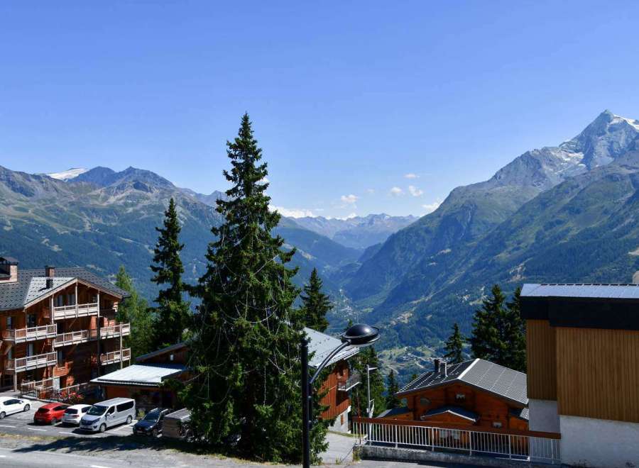 Experience breathtaking mountain views from this charming property.