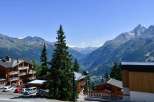 Experience breathtaking mountain views from this charming property.