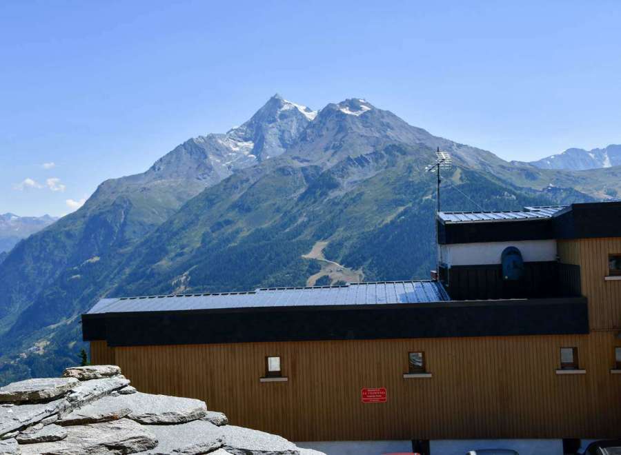 Experience breathtaking mountain views from this charming property.