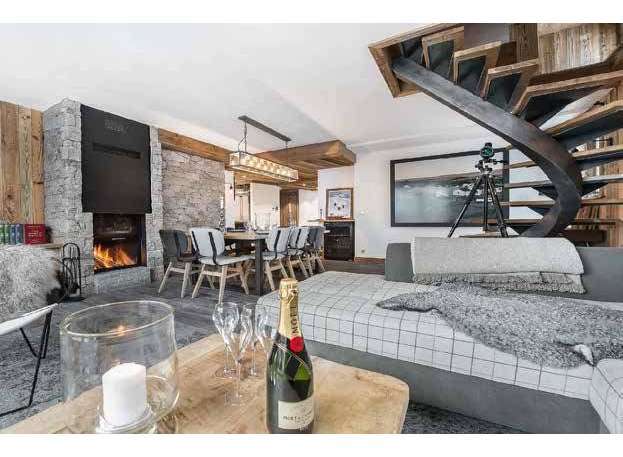 Experience luxury living in this stunning property, featuring a cozy fireplace perfect for chilly evenings.