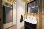 Step into a rustic bathroom retreat, where natural wood accents create a warm and inviting atmosphere.