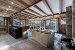 Experience luxury living in this stunning chalet, featuring a rustic wooden interior and breathtaking mountain views.