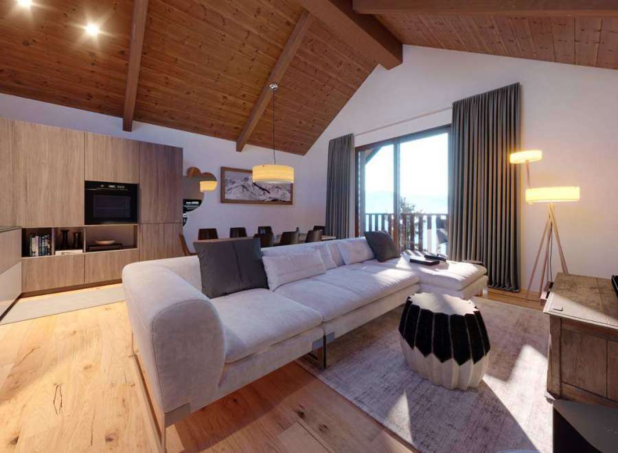 Experience luxury living in this stunning property, featuring a modern kitchen and a cozy living area with a comfortable sofa.