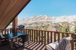 Enjoy breathtaking mountain views from this stunning balcony.