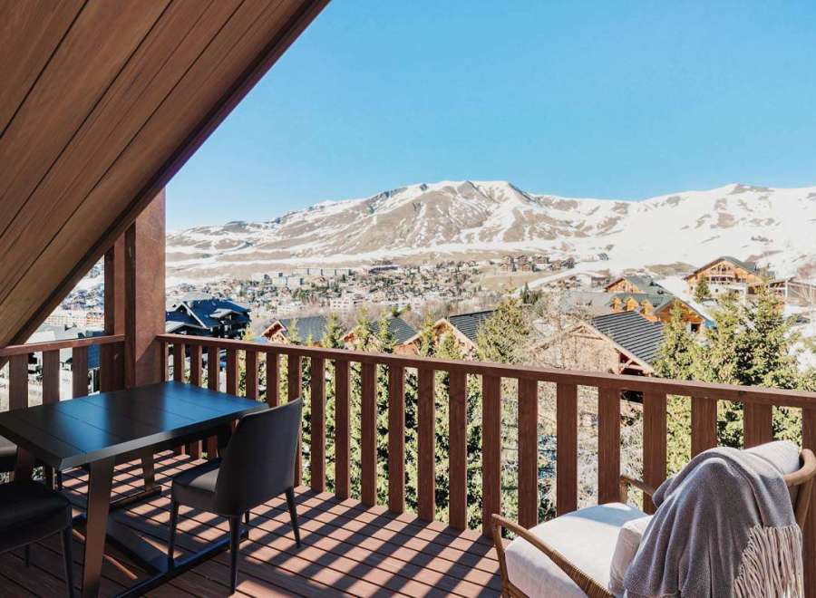 Enjoy breathtaking mountain views from this stunning balcony.