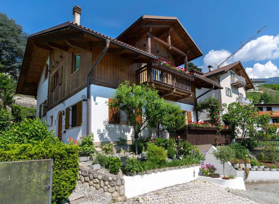 Discover the charm of this stunning property, showcasing a beautiful blend of wood and white exterior.