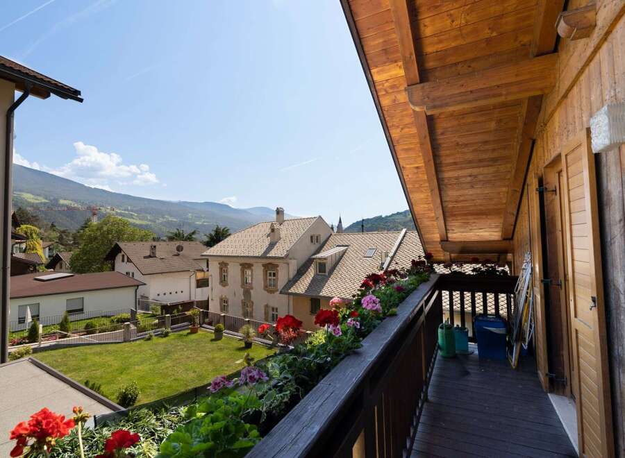 Enjoy breathtaking mountain views from this charming balcony.