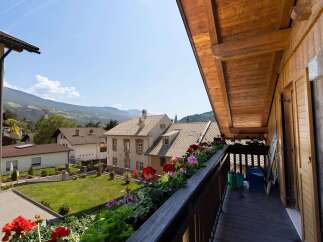 Enjoy breathtaking mountain views from this charming balcony.