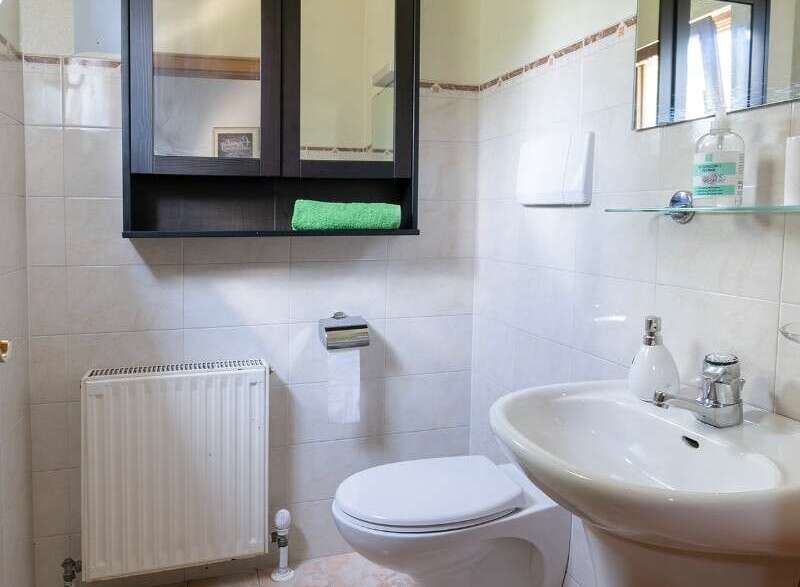 This bathroom features a stylish vanity with a modern sink and faucet.
