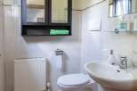 This bathroom features a stylish vanity with a modern sink and faucet.