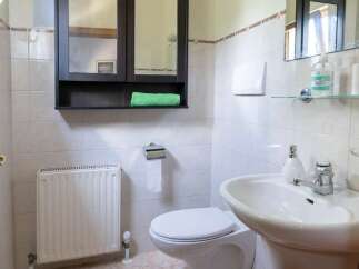 This bathroom features a stylish vanity with a modern sink and faucet.