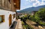 Discover the charm of this beautiful property, featuring a stunning wooden facade and a welcoming entrance.