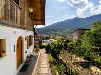 Discover the charm of this beautiful property, featuring a stunning wooden facade and a welcoming entrance.
