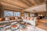 Experience luxury living in this stunning property, featuring a spacious living area with a cozy sectional sofa and a beautiful view.