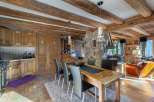 Experience rustic charm in this stunning property, featuring exposed wooden beams and a cozy stone fireplace.