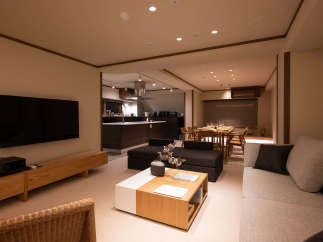 This stunning property boasts an open-plan living area seamlessly connecting the living room, dining area, and modern kitchen.