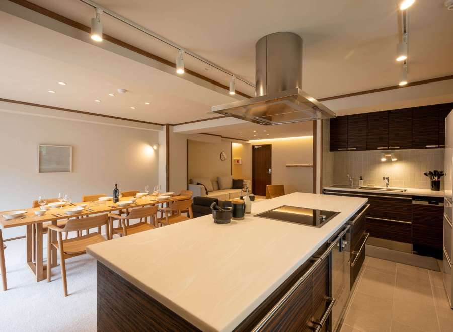 This stunning property boasts an open-plan living area seamlessly connecting the dining and kitchen spaces.