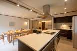 This stunning property boasts an open-plan living area seamlessly connecting the dining and kitchen spaces.