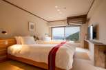Wake up to breathtaking mountain views from this serene hotel room.