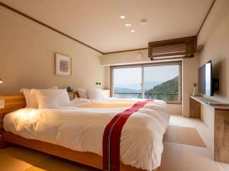 Wake up to breathtaking mountain views from this serene hotel room.