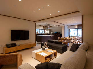 This stunning property boasts an open-plan living area seamlessly connecting the living room, dining area, and modern kitchen.