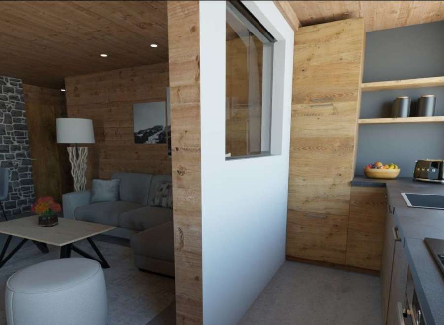 This stunning apartment boasts a spacious open-plan living area with a cozy seating arrangement and a modern kitchen.