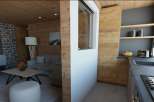 This stunning apartment boasts a spacious open-plan living area with a cozy seating arrangement and a modern kitchen.