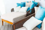 Relax and unwind on this luxurious balcony, complete with comfortable lounge seating and refreshing drinks.