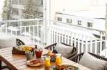 Enjoy a delightful breakfast or brunch on this stunning balcony, overlooking breathtaking mountain views.
