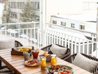 Enjoy a delightful breakfast or brunch on this stunning balcony, overlooking breathtaking mountain views.