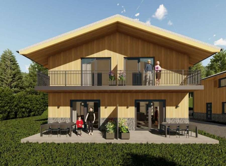 Discover your dream home! This stunning property boasts a modern design with a warm, inviting wooden exterior.
